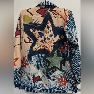 Step into a world of bold self-expression with this eye-catching blazer